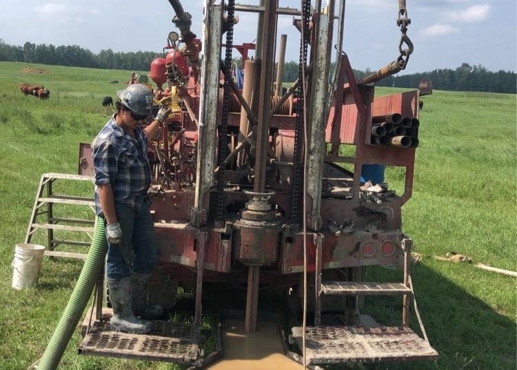 A Travis Drilling water well drilling pit at a job site