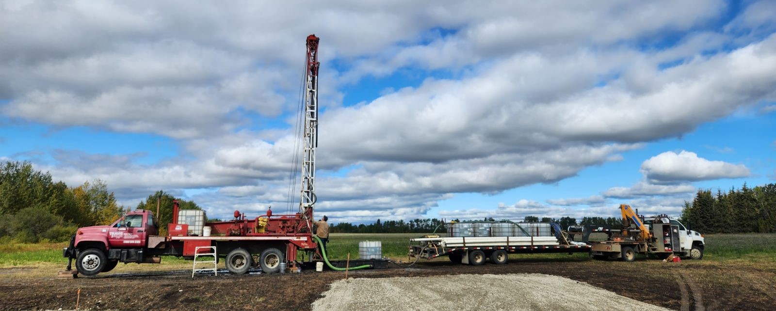Travis Drilling's rig set up at a water well job site